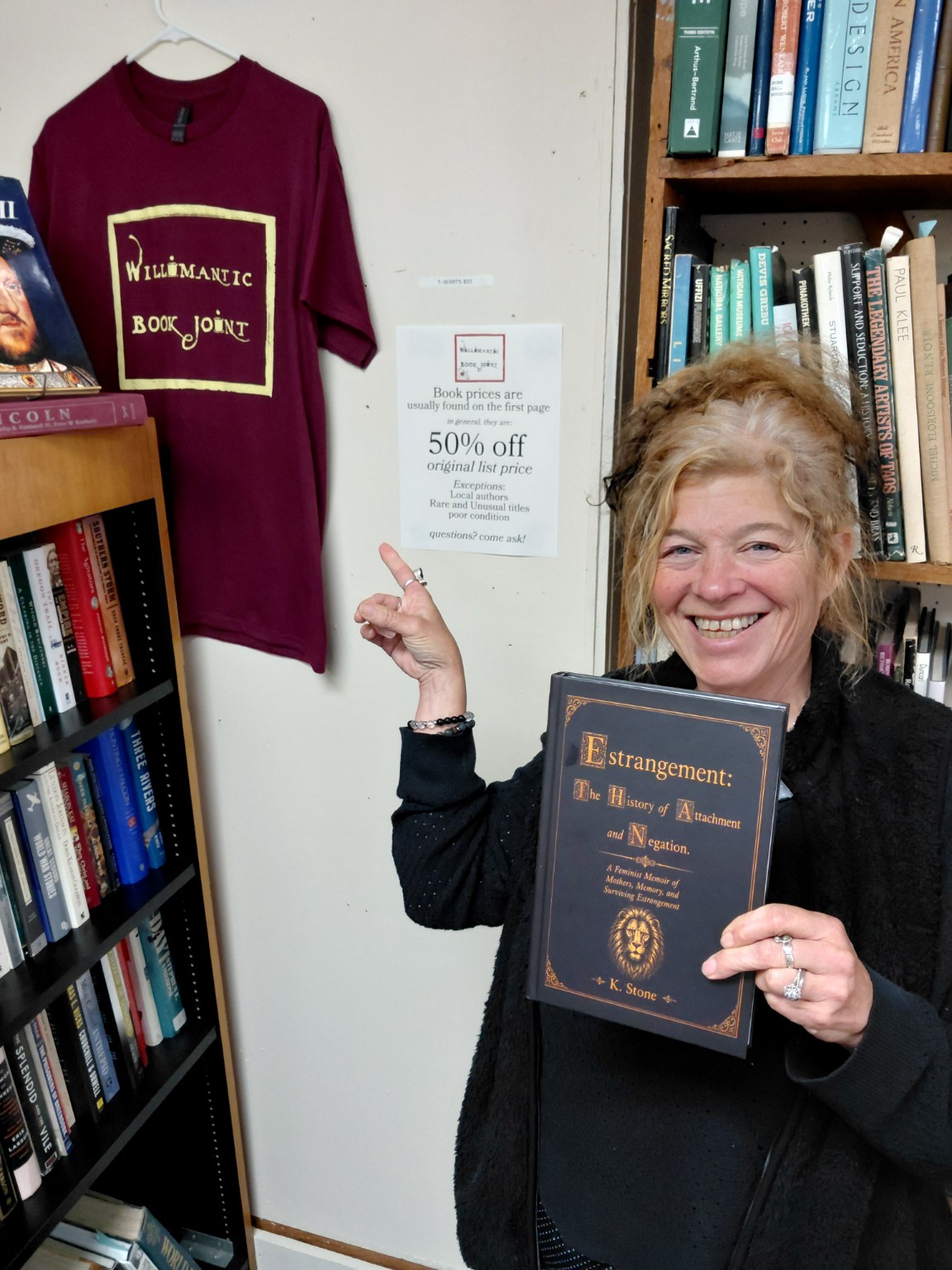Kristine Stone holding Estrangement at The Book Joint